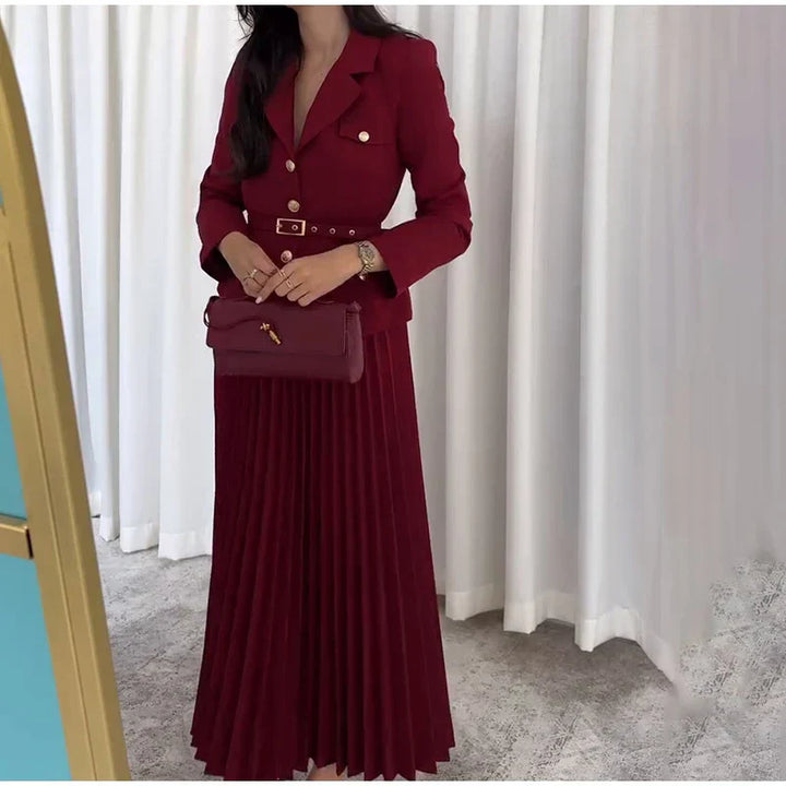 Conjunto Elegante com Casaco Alongado e Saia Plissada – Sofisticação em Dois Tempos